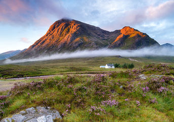 Sunrise over the mountain tops at Glencoe in the highlands of Scotland
