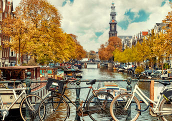 Bicycles stand on a bridge in Amsterdam