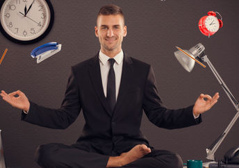 Businessman meditating desk office mindfulness