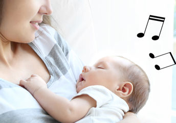 Young mother sings a lullaby to her baby.