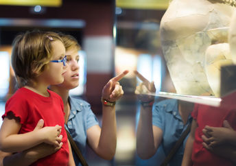 Mother and daughter at a history museum.