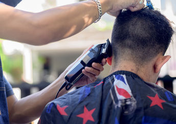 Cutting hair outside.