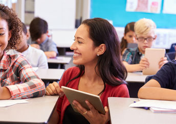 kids in a classroom on tablets