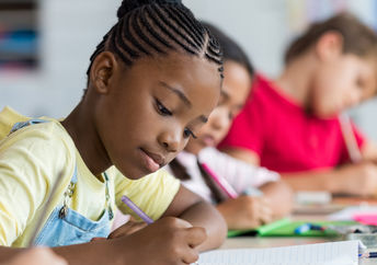 Pupils learning in a classroom