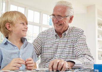 Grandfather playing with grandson