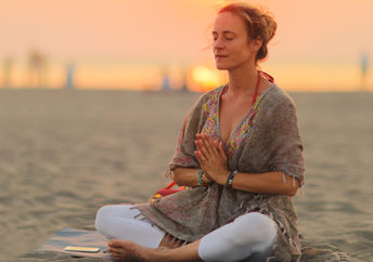 Practicing Kundalini yoga.