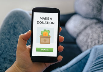 A smartphone with a donate button.