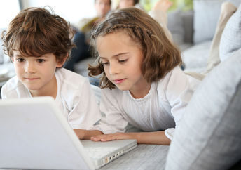 Kids playing 'a computer game.