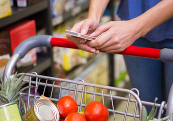 Woman shopping in supermarket.