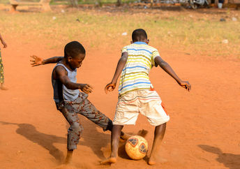 Children playing football.
