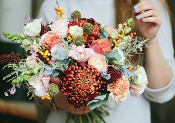 Woman holding beautiful bouquet of flowers