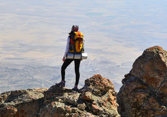 Self-confident woman makes it to the summit.