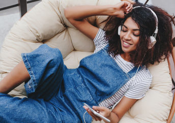 happy woman listening to an inspiring song.