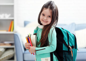 Little girl heading to her first day back at school