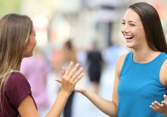 Two friends greeting each other.