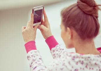 Girl taking a selfie.
