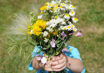 Child with flowers.