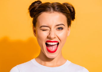 Portrait of a funny lady winking.