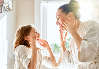 Mother and daughter with healthy skin.