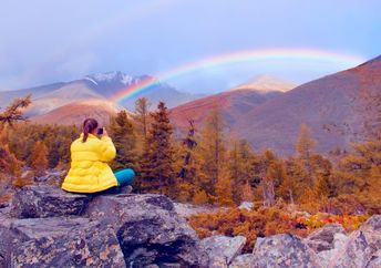 Finding courage while seated in nature admiring a rainbow.
