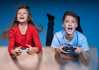 Kids having fun playing a video game.