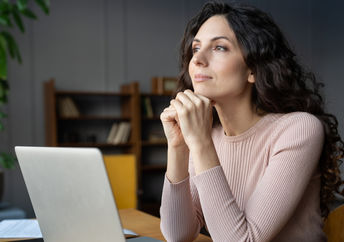 Woman distracted from her office work.