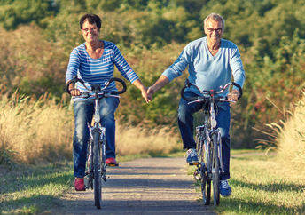 Biking outdoors like this couple is a great way to increase mitochondria.