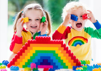 Kids playing with LEGO bricks.