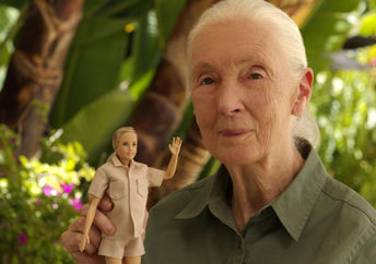 Jane Goodall holding the Jane Barbie doll.
