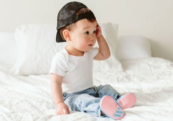 This baby is wearing Woolybobs newbie shoes.