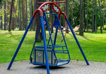 Wheelchair accessible swing in a park.