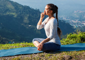 Woman practicing breathing exercises.
