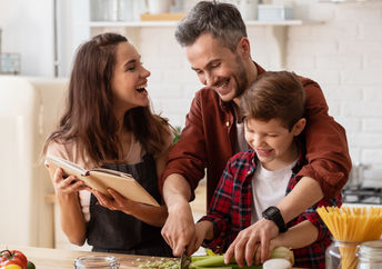 Family cooking a healthy meal.