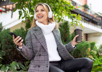 Taking a lunch break outside in a green space.