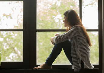 Depressed teenager spending time alone.