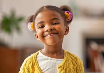 Smiling and self-confident cute little pupil.