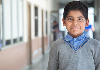 A little child with a uniform.