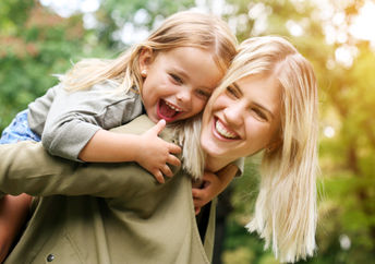 A young girl with her mother.