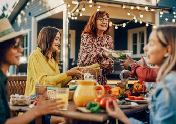 Family laughing and talking together at family gathering