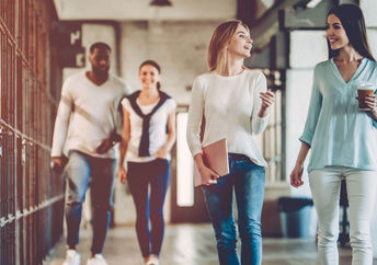 Office workers take a break from desk work and enjoy a healthy walk.