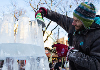 putting the finishing touches on an ice scupture.