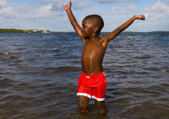 a boy's first time in the ocean.