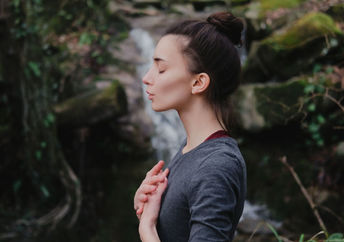 Woman practicing breathing exercises.