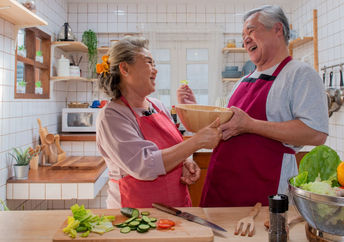 Senior couple preparing a healthy meal.