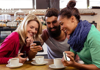 Three friends having coffee together.