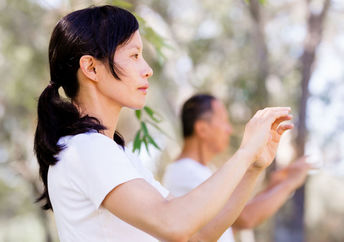 Woman practicing tai chi.