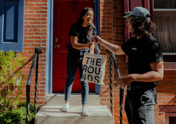 Groceries are delivered in reusable canvas bags.