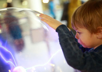 A young child studying science.