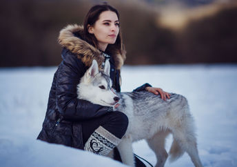 Indigenous woman with her dog companion.