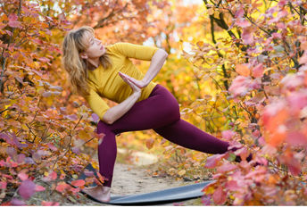 Practicing yoga amongst the autumn leaves. (O_Lypa / Shutterstock.com)